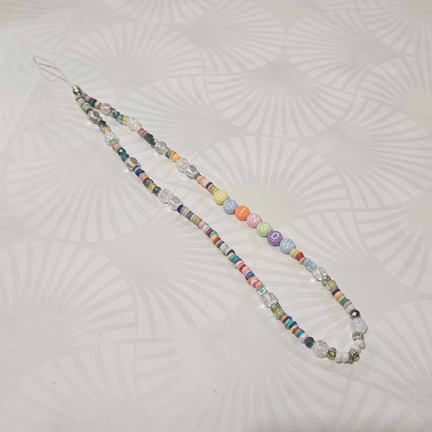 Cordon de téléphone RAINBOW avec pierres cristal de roche